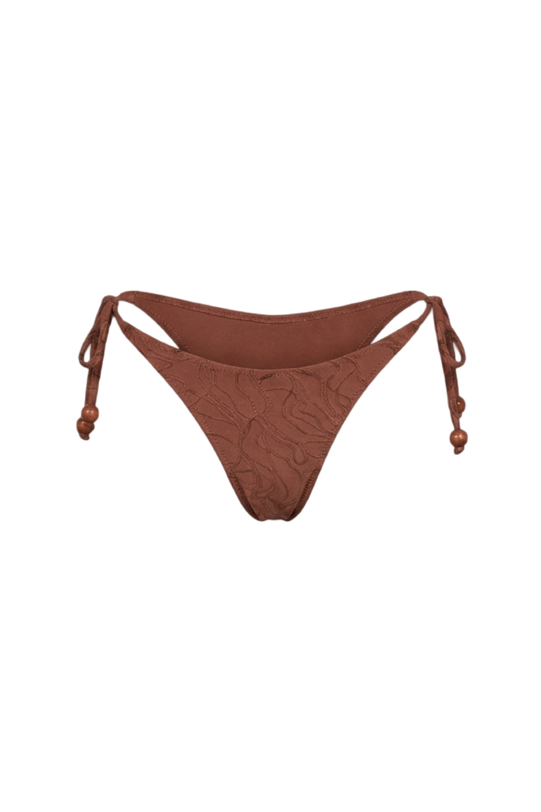 A pair of low-rise bikini bottoms in a textured rust brown color, featuring side-tie straps and a subtle tonal leaf pattern, displayed against a solid white background.